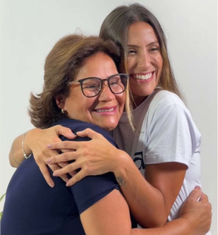 A founder embracing her mother